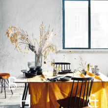 Mustard yellow table setting in scandinavian industrial loft