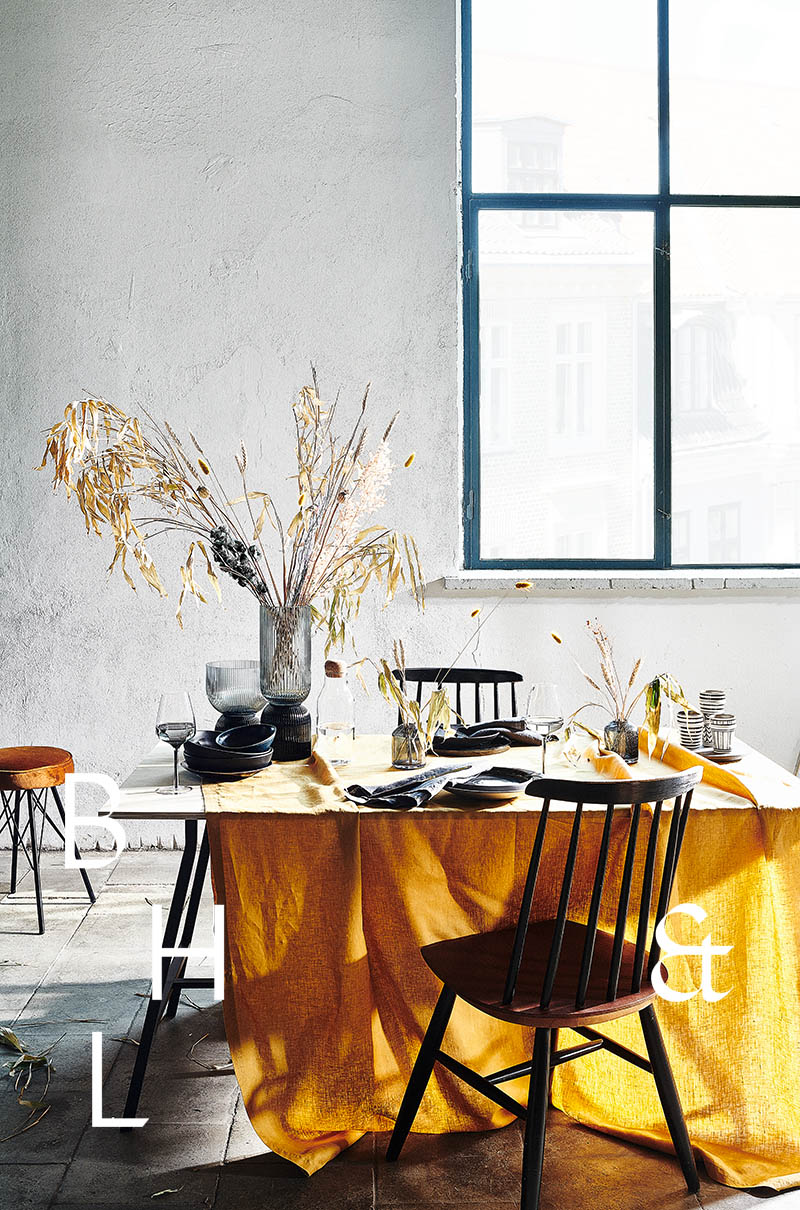 Mustard yellow table setting in scandinavian industrial loft