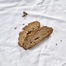 Slices of fresh rustic bread on white background food photography