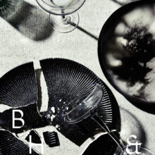 Flatlay of broken plates and glasses on concrete background