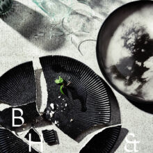 Flatlay of broken plates and glasses on concrete background