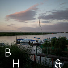 Travel photography of a lake in Poland with boats in a small harbour