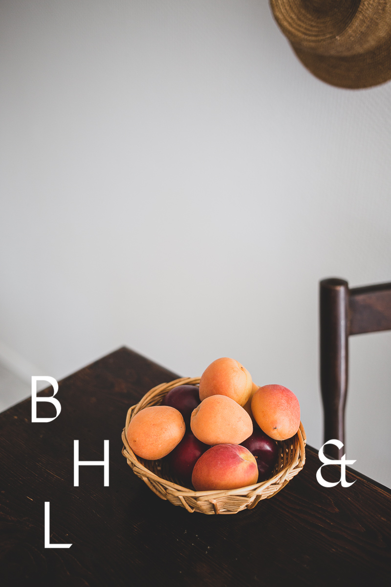 Food photography with apricots in a basket on a table