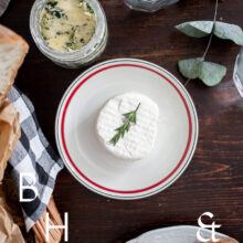 Food photography of a house boat in Poland with a top shot from the table with goat cheese, bread and herb butter