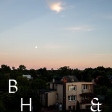 Travel photography in Poland with the evening sky above a house