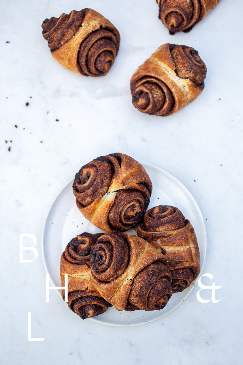 Food photography of cinnamon buns on white marble