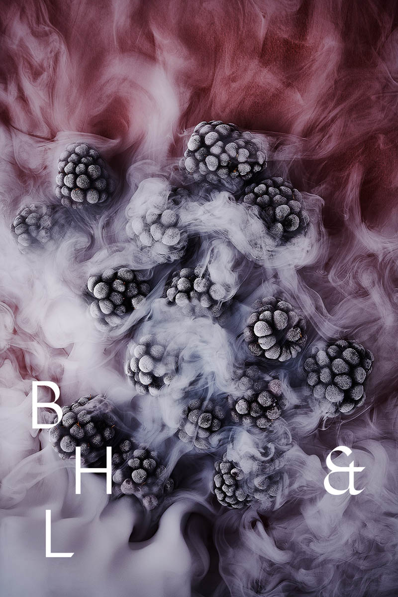 Frozen blackberries in smoke on pink background - food photography Anna Schneider