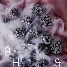 Frozen blackberries in smoke on pink background - food photography Anna Schneider