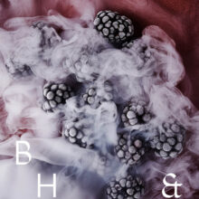 Frozen blackberries in smoke on pink background - food photography Anna Schneider