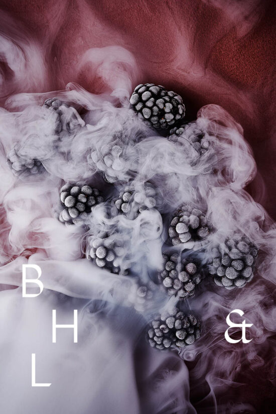 Frozen blackberries in smoke on pink background - food photography Anna Schneider