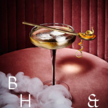 Honey Whisky cocktail photography in smoky pink bar