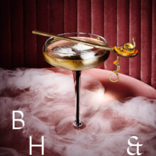 Honey Whisky with orange zest cocktail photography in smoky pink bar