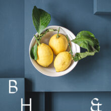 Food photography of Lemon in a white bowl on blue ground